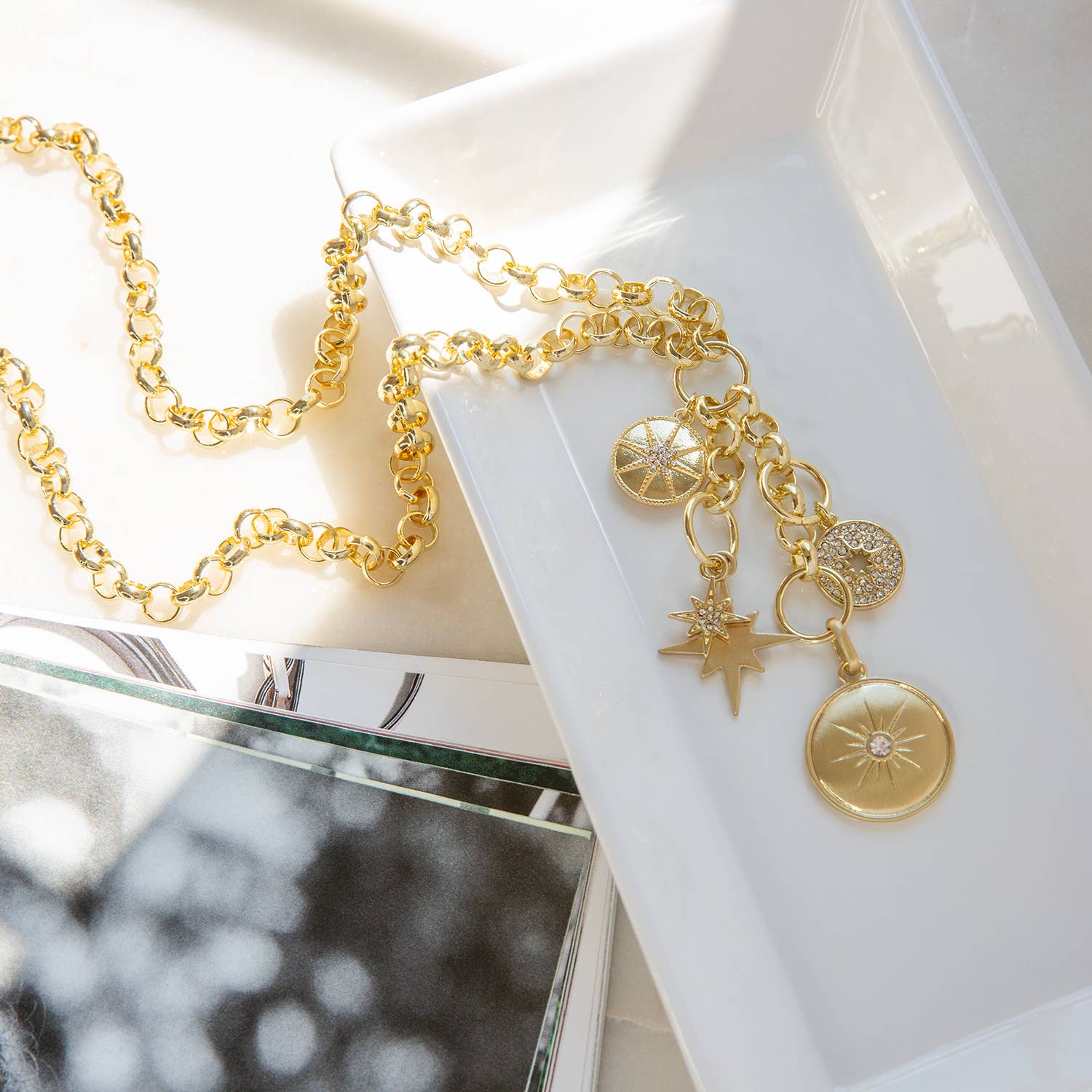 Rolo link necklace with multiple charms: Gold